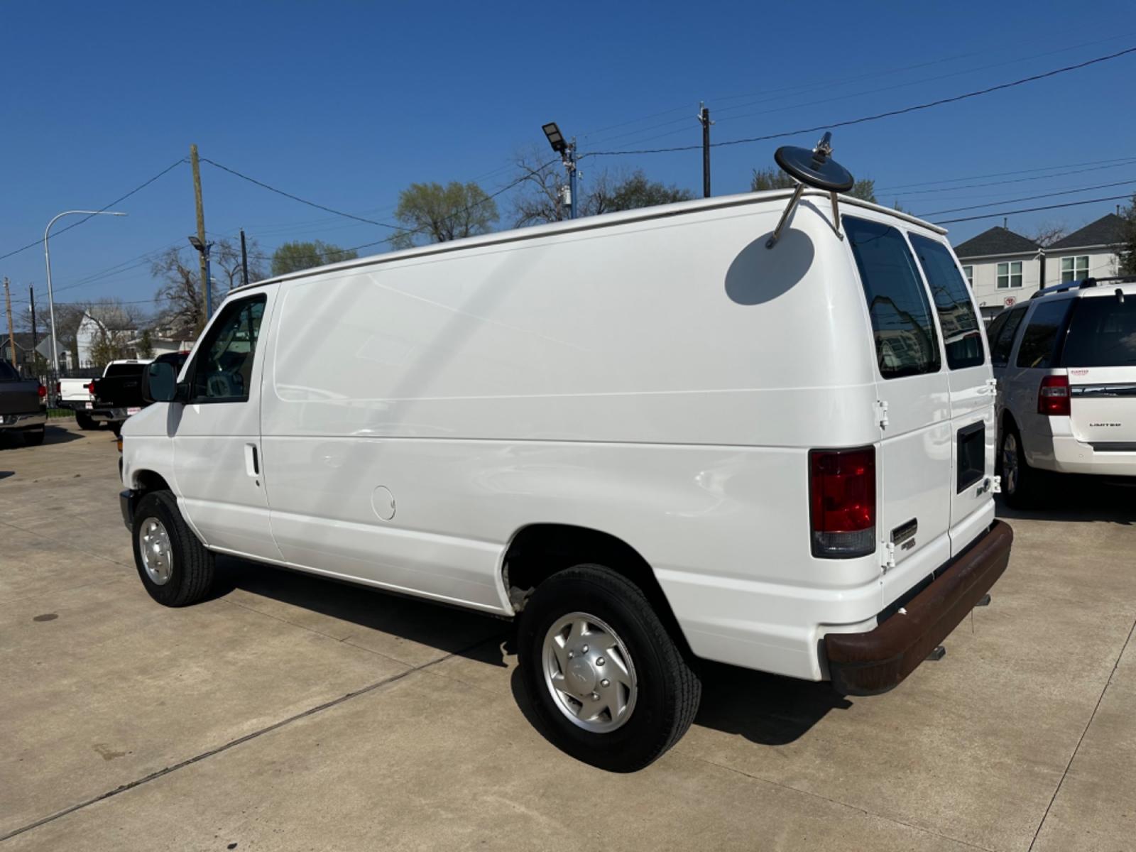 2011 White /Gray Ford E-Series Van (1FTNE2EWXBD) with an 4.6L engine, Automatic transmission, located at 1501 West 15th St., Houston, 77008, (713) 869-2925, 29.797941, -95.411789 - Photo #3